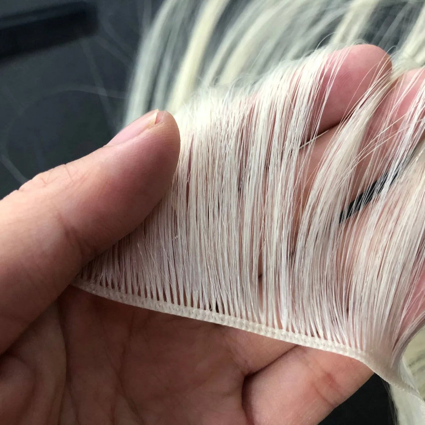 Genius weft human hair extension construction