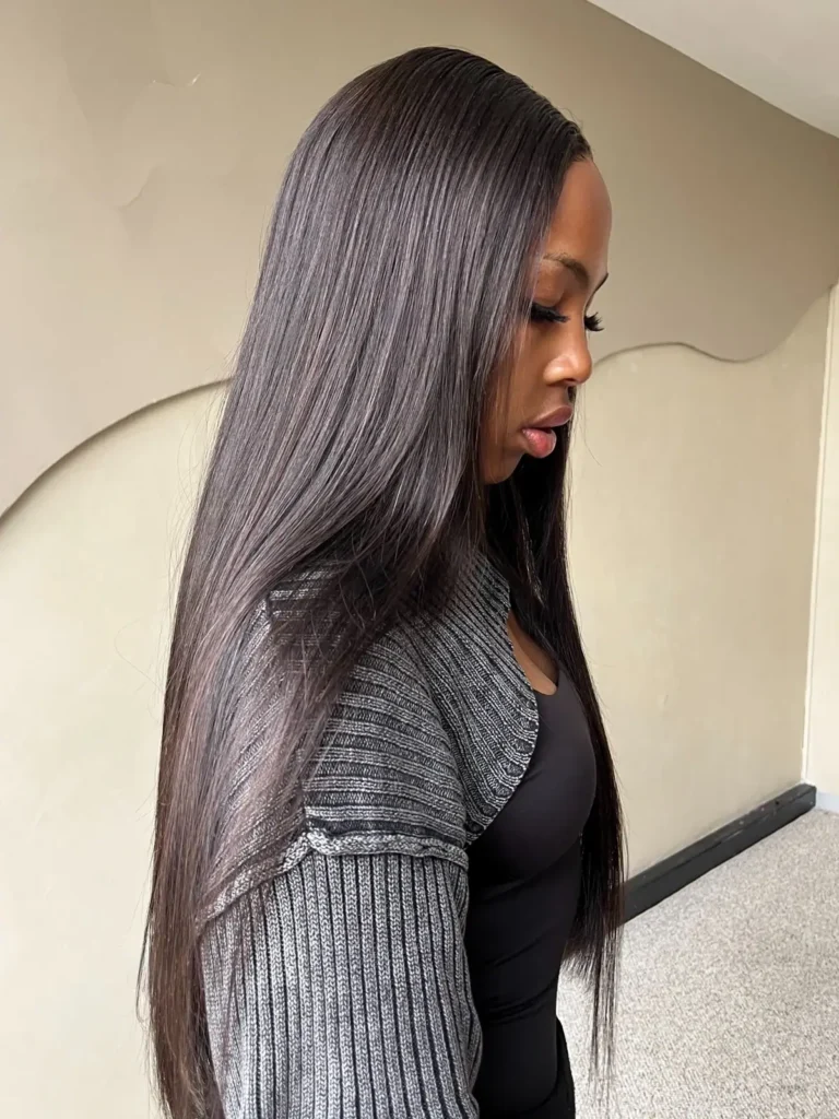 Model with long dark straight hair, shown in profile
