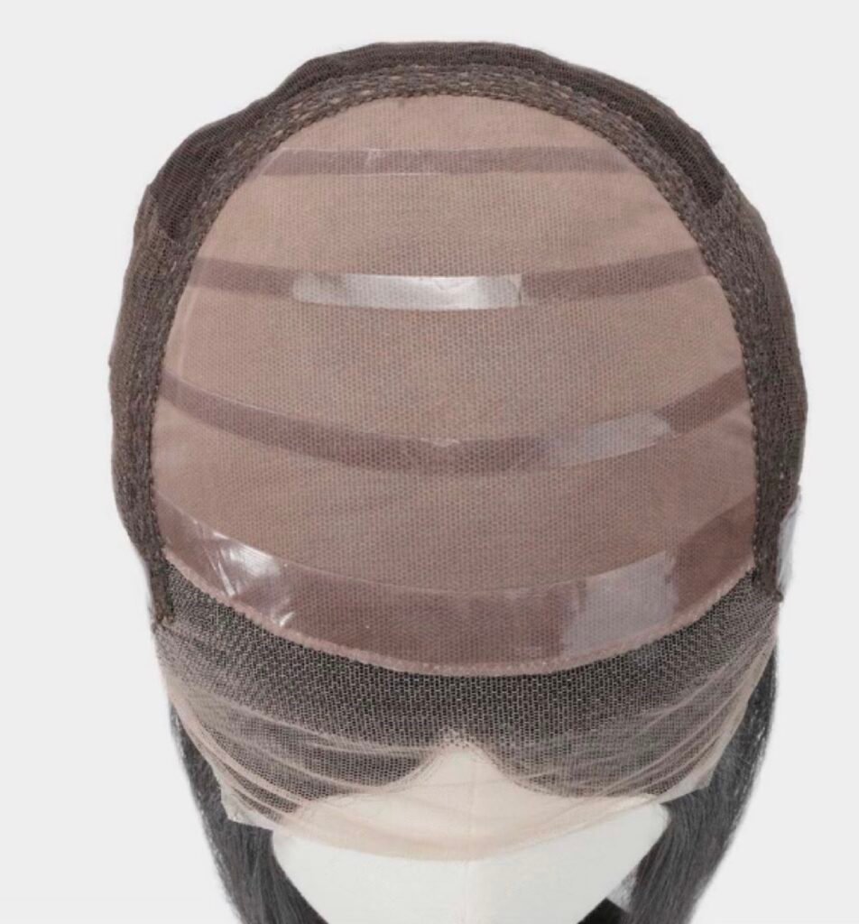 Interior of a wig cap showing mesh panels, lace front and reinforcing strips