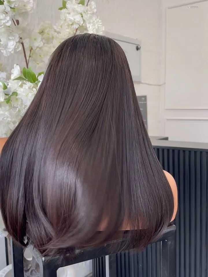 Rear view of a smooth dark shoulder-length hairstyle