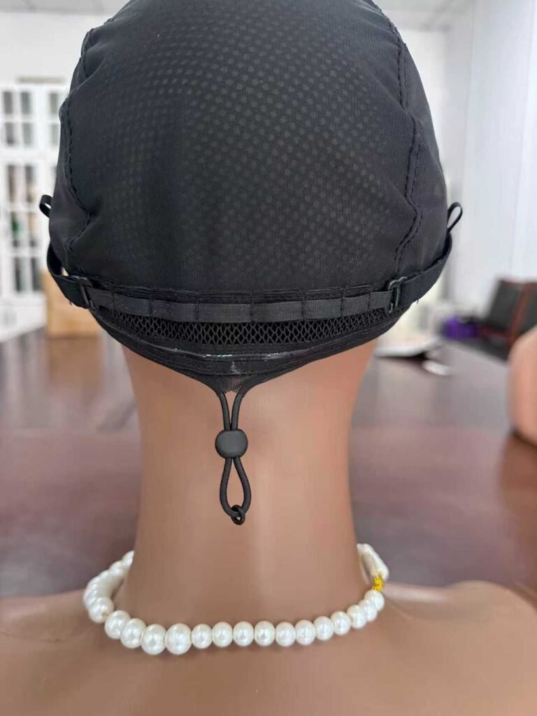 Rear view of the updated 360-degree glueless wig drawstring on a mannequin, showing the adjustment cord, toggle and back band